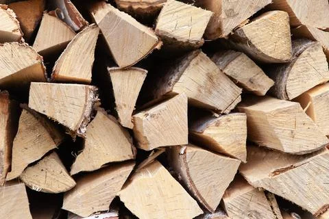 Background from stack of firewood from birch tree, for heating house, stacked Stock Photos