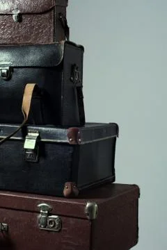 Background stack of old shabby suitcase Stock Photos