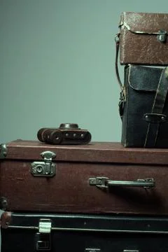 Background stack of old shabby suitcases and the camera 스톡 사진