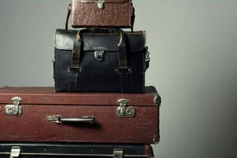 Background stack of old suitcases form a tower Stock Photos