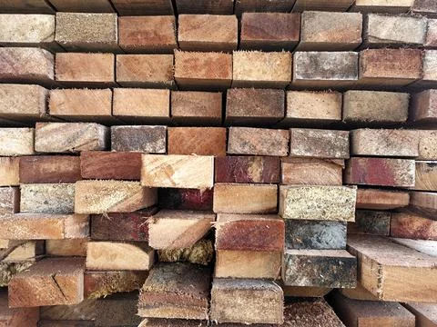 Background of Stacked Wood Cut in Squared Timber Stock Photos
