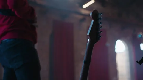 In the background, stage workers prepare equipment before the concert Stock Footage 241998715