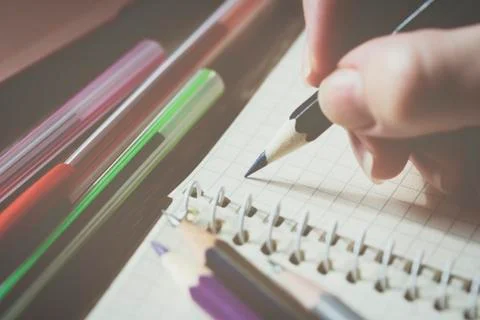 Background of stationery items notepad pencils shot closeup. Stock Photos