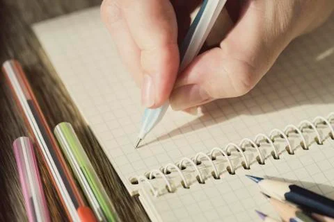 Background of stationery items notepad pencils shot closeup. Stock Photos