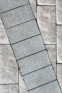 The background of a stone brick wall of gray color, where a number of bricks  Stock Photos