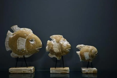 Background stone fish figurines Stock Photos