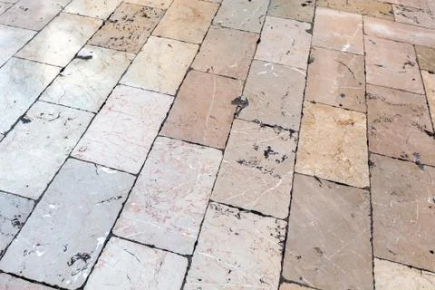 Background of a stone floor made of rectangular shiny smooth slabs 库存照片