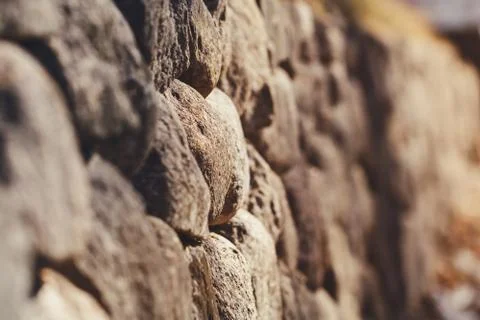 Background from a stone medieval hedge. Macro photography. Selective focus Stock Photos