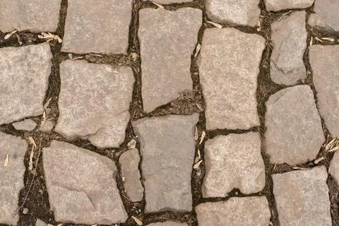 Background of stone-paved uneven track Fotos Stock