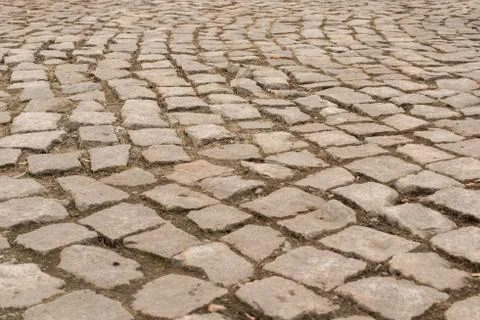 Background of stone-paved uneven track Stock Photos