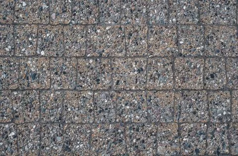 Background stone paving slabs, surface path dusty with sand close-up Stock Photos