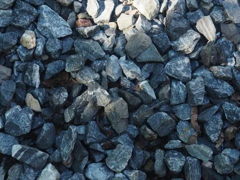 Background of stone pebbles. Texture of stone pebbles. Stock Photos