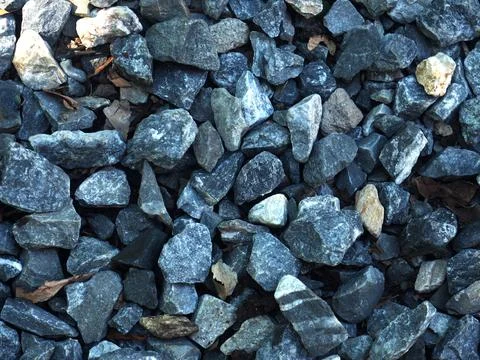 Background of stone pebbles. Texture of stone pebbles. Stock Photos