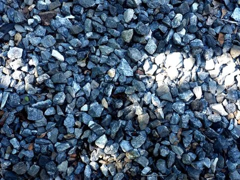 Background of stone pebbles. Texture of stone pebbles. Stock Photos