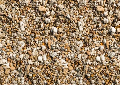 Background stone small pebble beige brown natural texture, sea beach Stock Photos