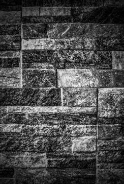 A background of stone wall in black and white Stock Photos