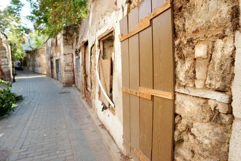 Background of stone wall with boarded window. Stock Photos