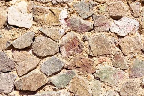 Background of stone wall. The texture and surface of the stone.. Fotos de archivo