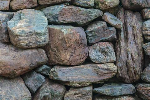 Background of a stone wall texture Stock Photos
