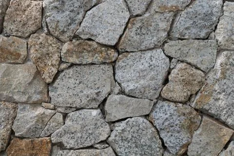 Background of stone wall texture Stock Photos