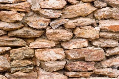 Background of stone wall texture Stock Photos