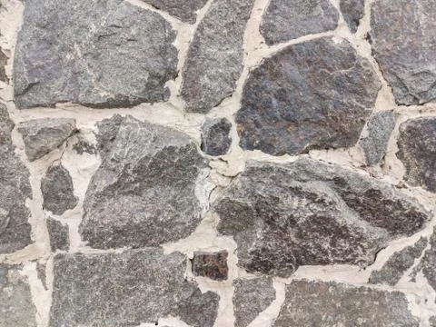 Background of stone wall texture Stock Photos