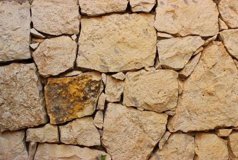 Background of stone wall texture Stock Photos