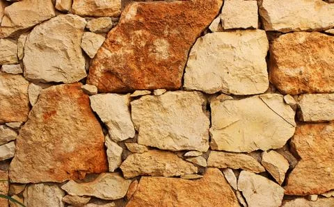 Background of stone wall texture Stock Photos