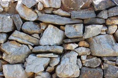 Background of stone wall texture Stock Photos