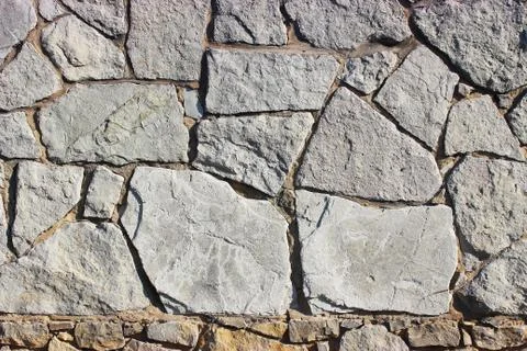 Background of stone wall texture Stock Photos