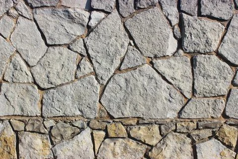 Background of stone wall texture Stock Photos