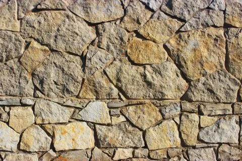 Background of stone wall texture Stock Photos
