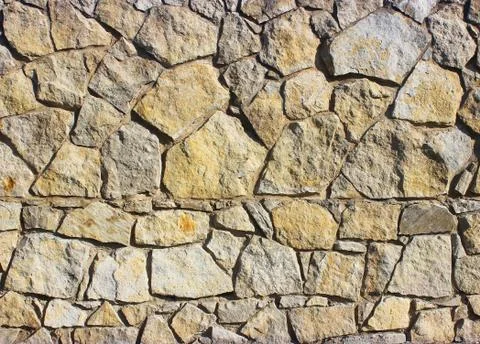 Background of stone wall texture Stock Photos