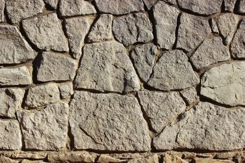 Background of stone wall texture Stock Photos