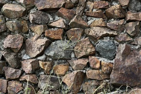 Background of stone wall texture. Stock Photos