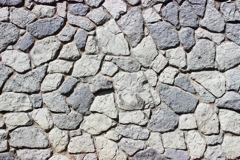 Background of stone wall texture Stock Photos