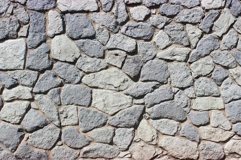 Background of stone wall texture Stock Photos
