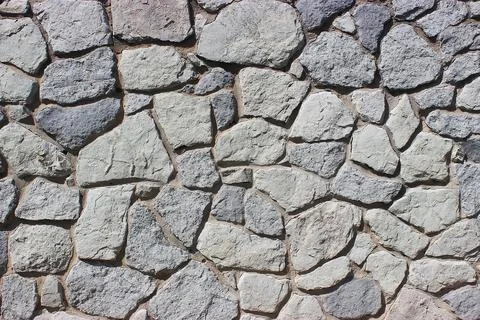 Background of stone wall texture Stock Photos