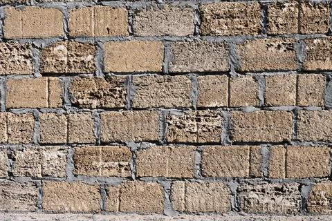 Background. Stone wall texture. The shell rock material is bonded with cement Stock Photos