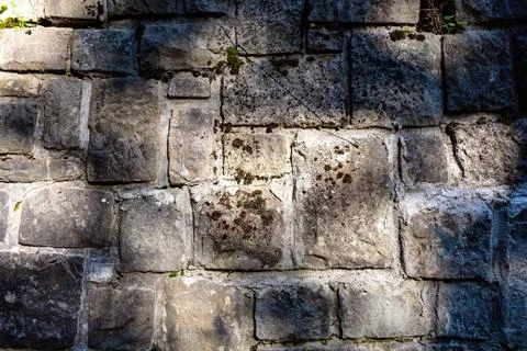 Background of stone wall texture. The surface of the stones is brown Stock Photos