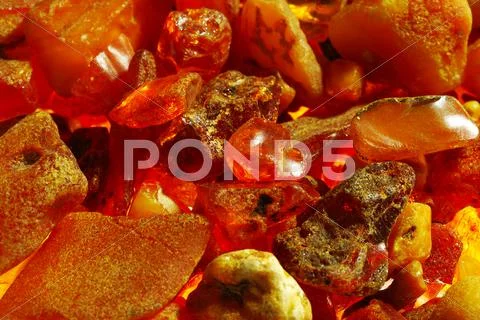 Background from stones of amber Stock Photos