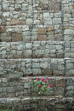 Background of stones, fixed wire Stock Photos