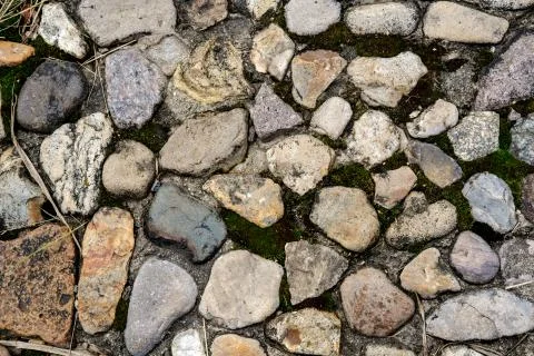 Background from stones in the ground. Stock Photos