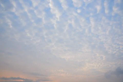 Background of stratocumulus clouds on blue sky Stock Photos