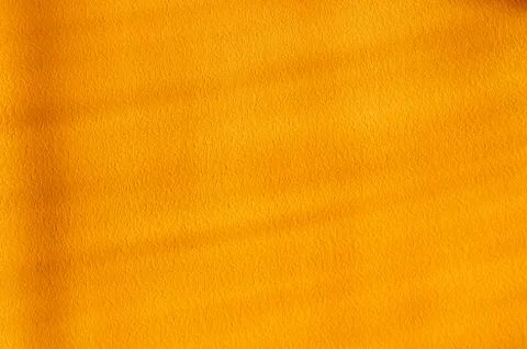 Background of sun light shadow over yellow textured wall Stock Photos