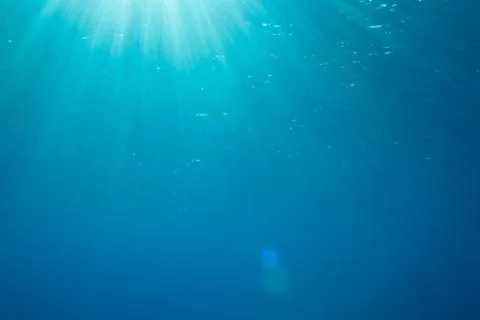 A background with sunbeams underwater Stock Illustration