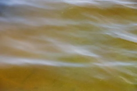 Background of surface of the Dnieper River. River water in autumn in rays o.. Stock Photos