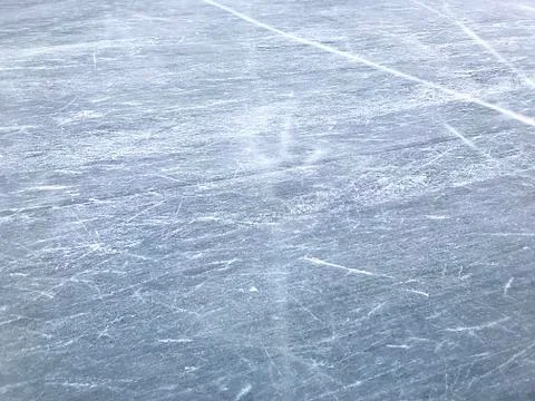 Background - the surface of the ice rink, ice. Stock Photos