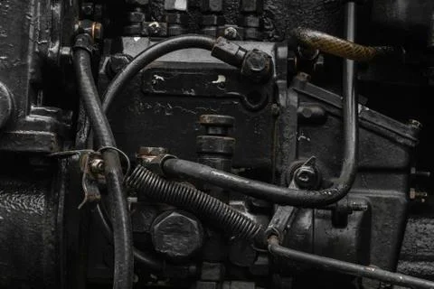Background surface of old, black and oily machine engine Stock Photos