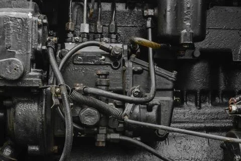 Background surface of old, black and oily machine engine Stock Photos